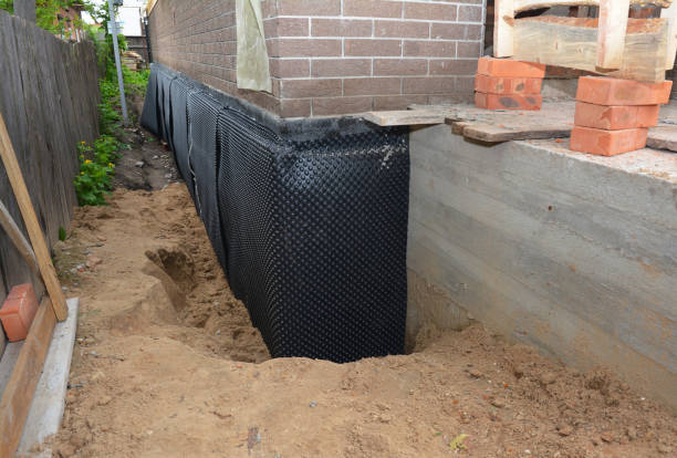 Happy homeowners after waterproofing job in Pegram